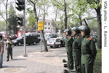 Paramilitary police guard street near Japanese Embassy, Saturday